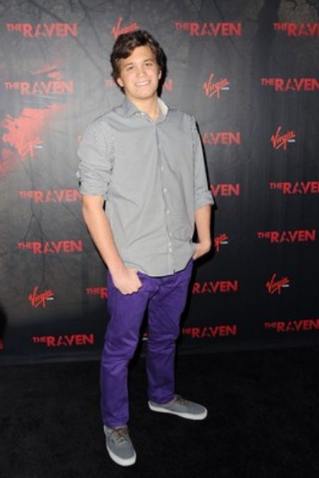 He is posing for a photo.